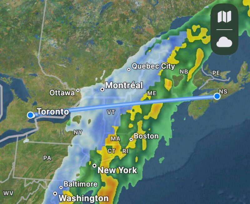 Flight path from Halifax to Toronto with a weather overlay showing a large snow and rain storm from Labrador to Washington D.C. but not affecting Halifax or Toronto.