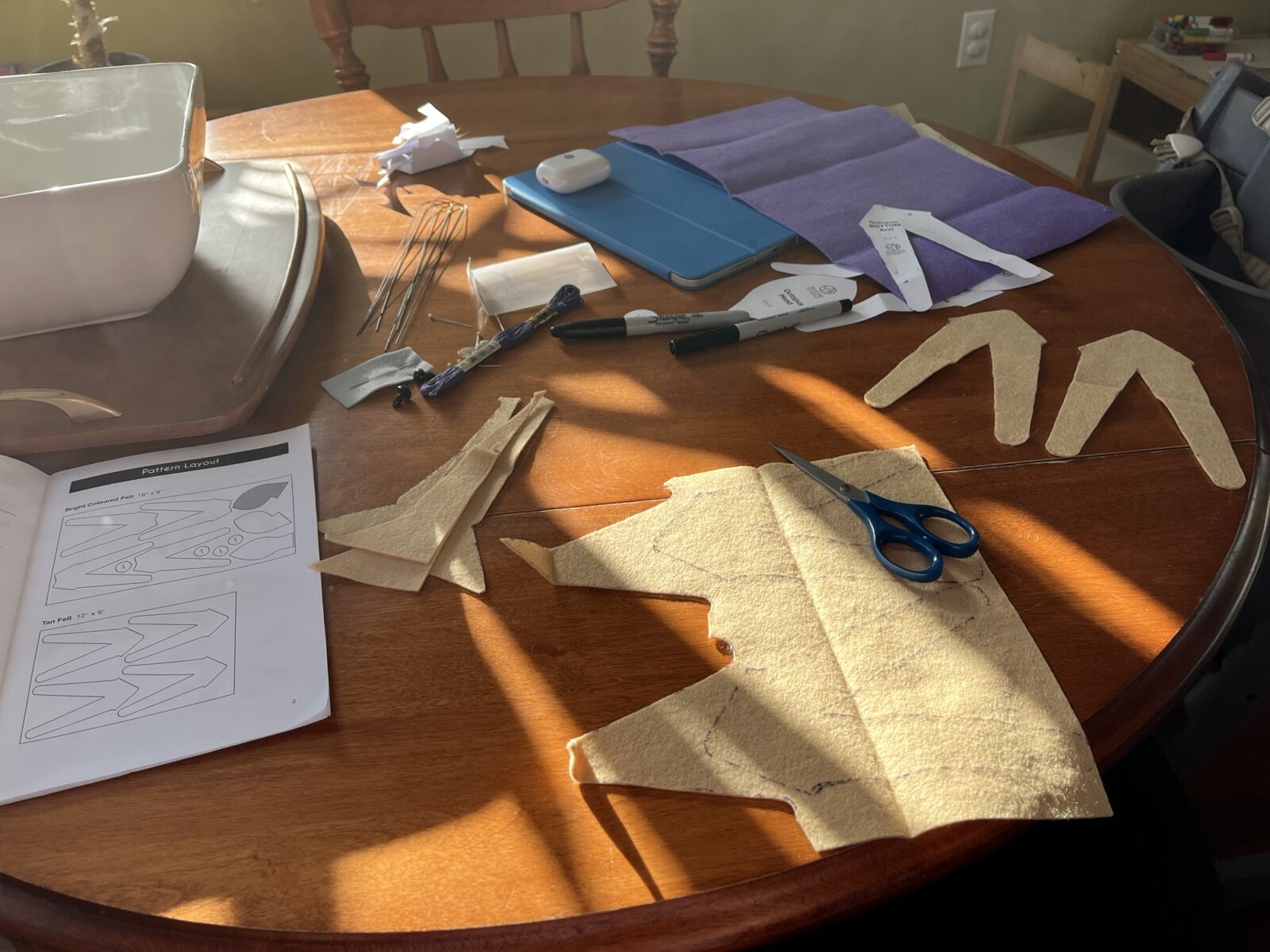 In progress construction shot showing pattern pieces traced onto felt and the first 2 pieces cut out.