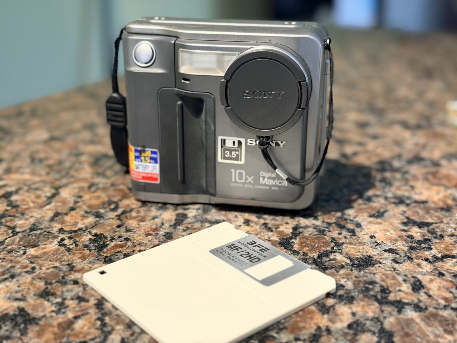Sony Digital Mavica with its floppy disk storage in front of it